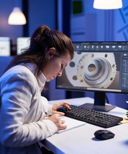 Woman engineer architect working in modern cad program sitting at desk in start-up business office. Industrial employee start new prototype idea on computer using inovative design concept